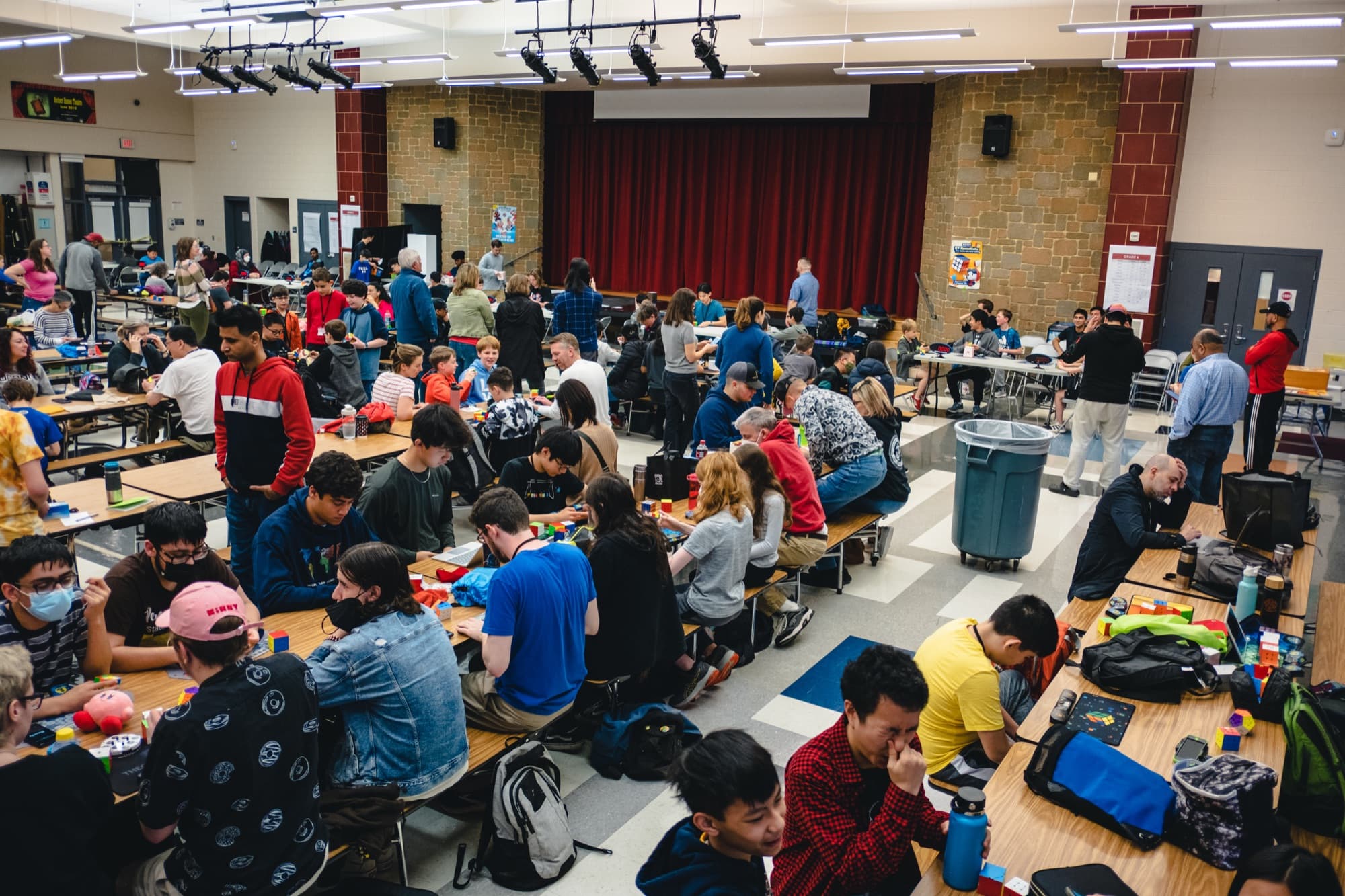 A wide view of the crowded competition floor at the Potomac Spring 2023 WCA tournament